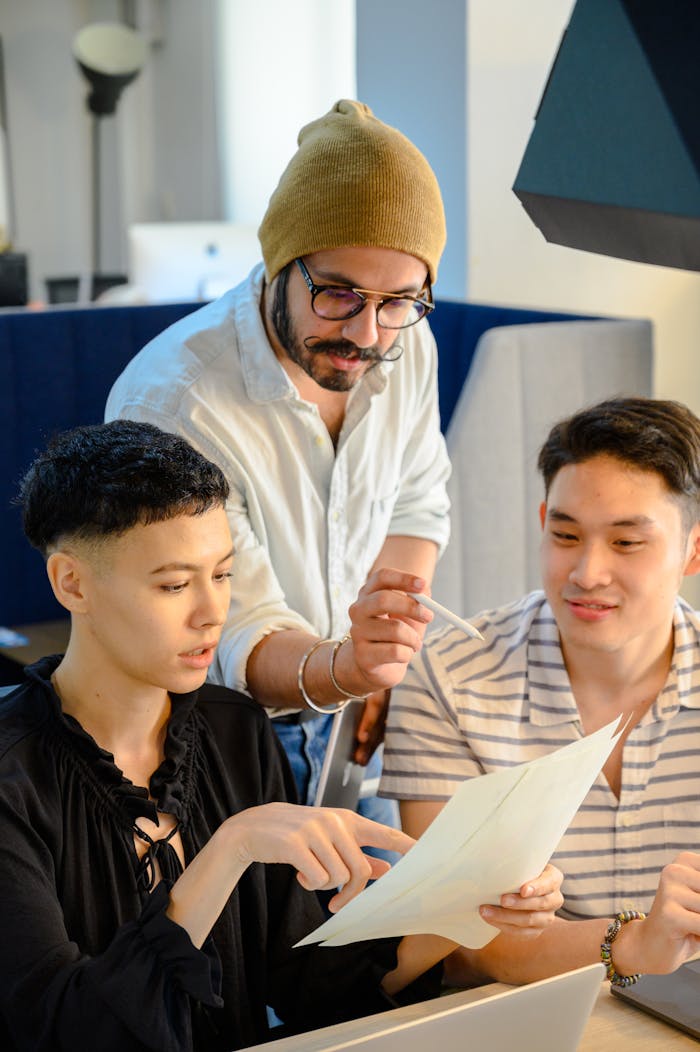 hero-img-01 Group of diverse adults collaborating in a modern office environment.